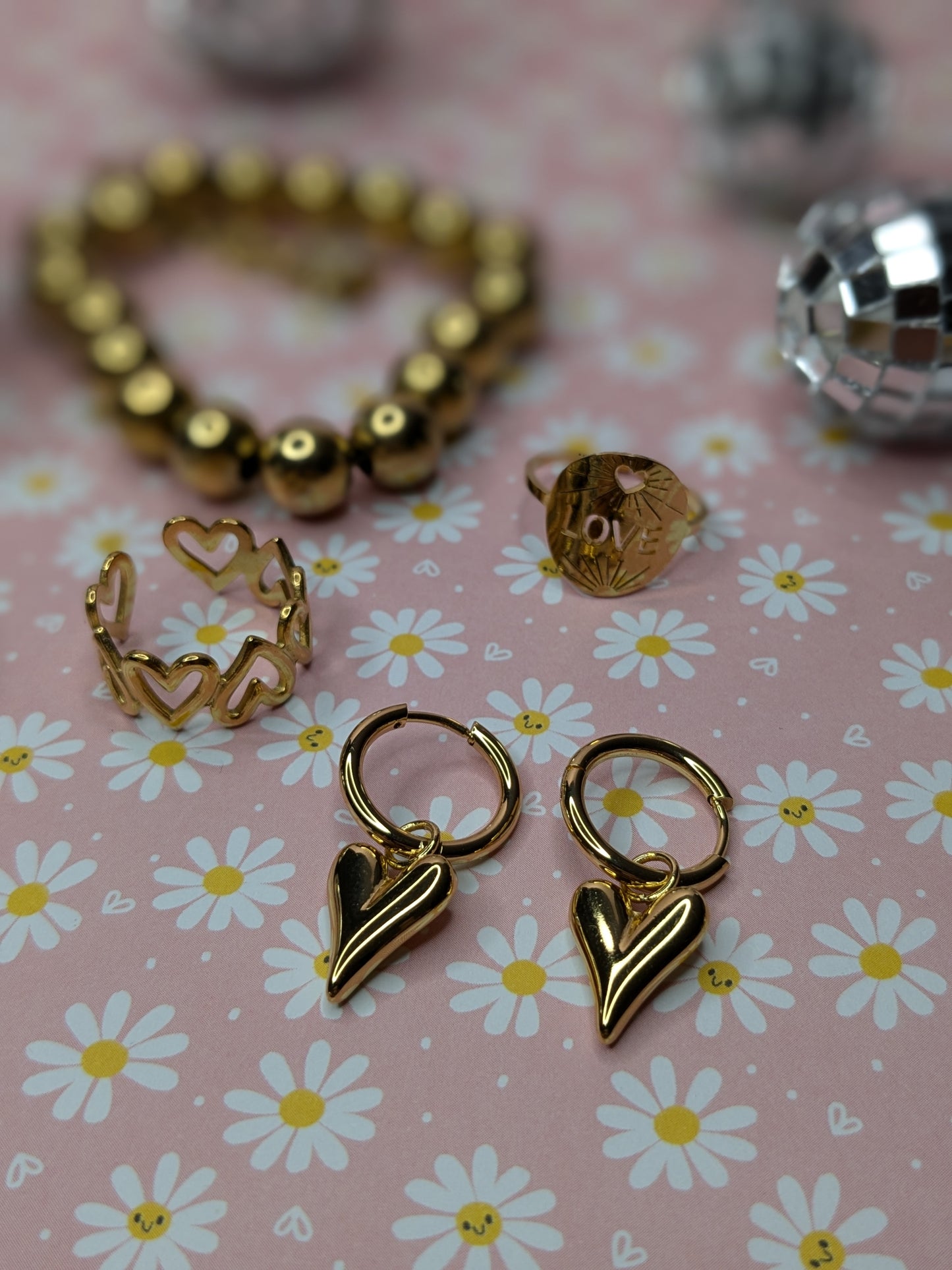 Boucle d'oreille ronde cœur d'acier doré